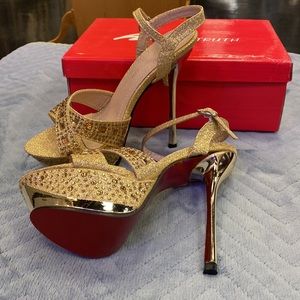 New.  Gold high heels